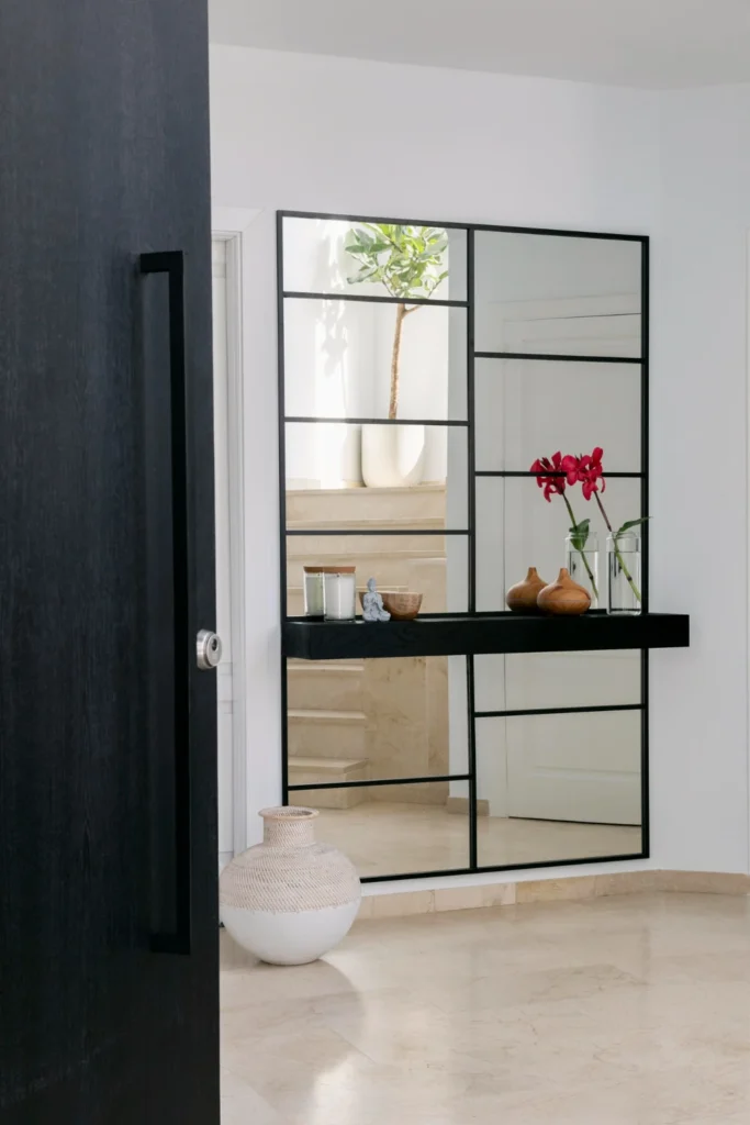 a collection of mirrors arranged on neutral wall