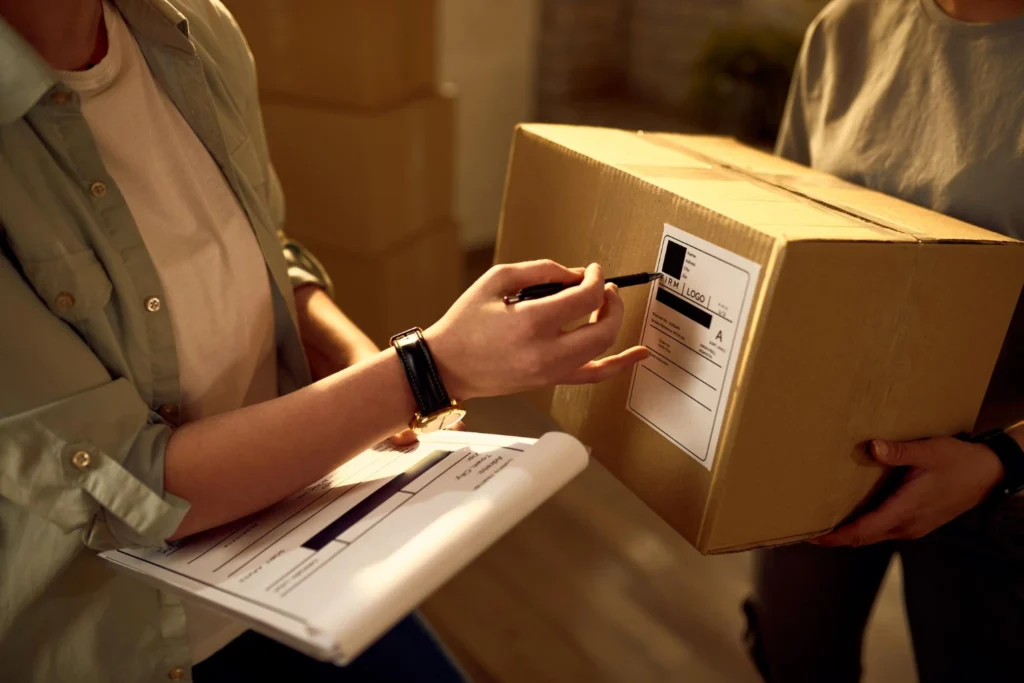 picture of a deliveryman checking the customer data