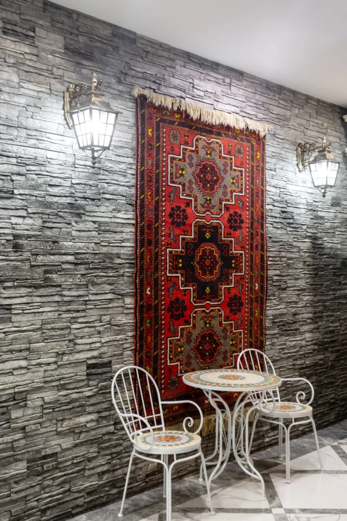 a colorful rug hanging on a wall