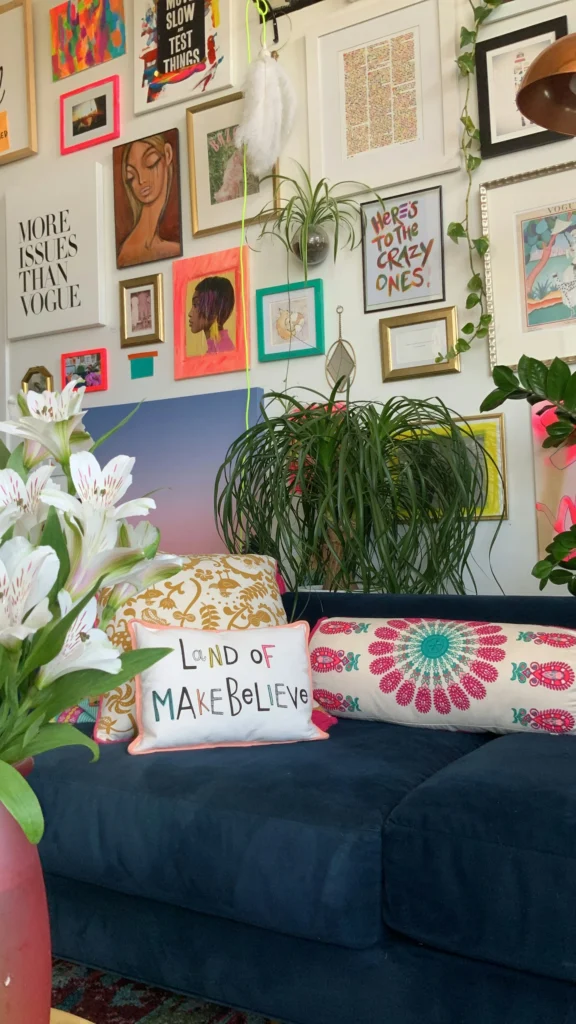 a living room full of paintings and decorations
